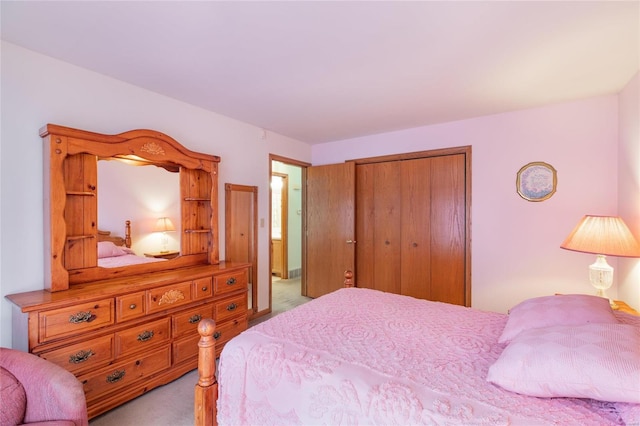 carpeted bedroom featuring a closet