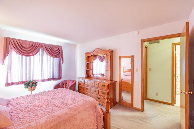 bedroom with light colored carpet