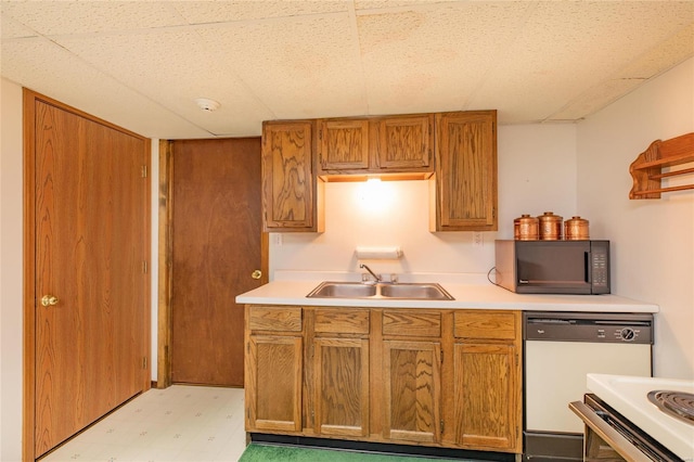 kitchen with white dishwasher and sink