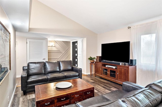 living room with hardwood / wood-style flooring and vaulted ceiling