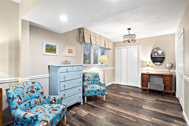 sitting room with dark hardwood / wood-style floors