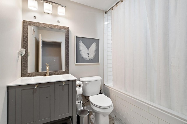 full bathroom with vanity, shower / bath combination with curtain, and toilet