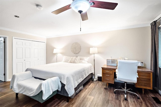 bedroom with ornamental molding, dark hardwood / wood-style flooring, and a closet