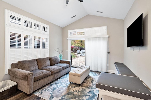 living room with vaulted ceiling, dark wood-type flooring, and ceiling fan