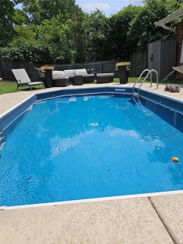 view of swimming pool featuring an outdoor living space