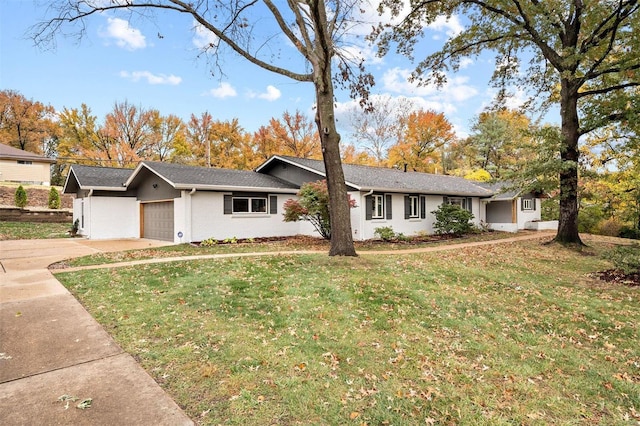 ranch-style house featuring a garage and a front yard