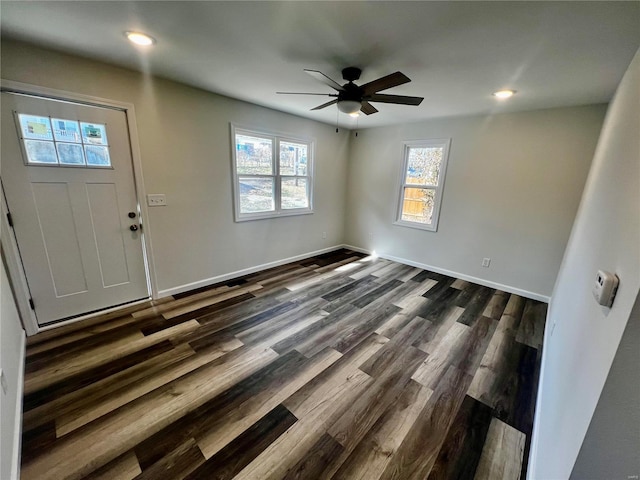 entryway with dark wood-type flooring and ceiling fan