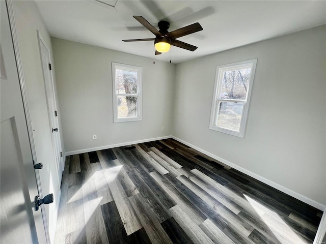 unfurnished bedroom featuring dark wood-type flooring and ceiling fan