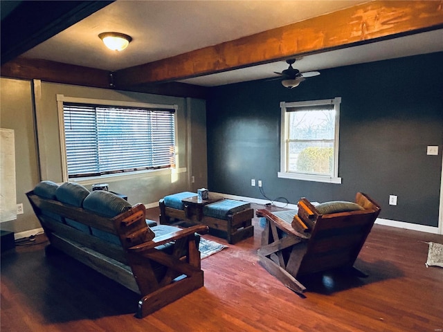 living room with hardwood / wood-style flooring, ceiling fan, and beam ceiling