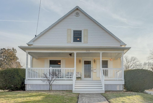 view of front of home featuring a porch and a front lawn