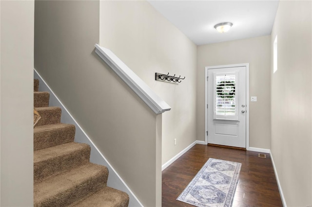 foyer with dark hardwood / wood-style floors