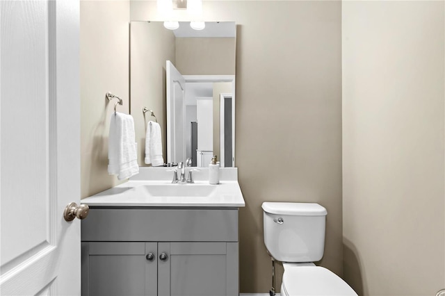 bathroom with vanity and toilet