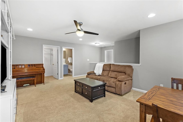 living room with ceiling fan and light carpet