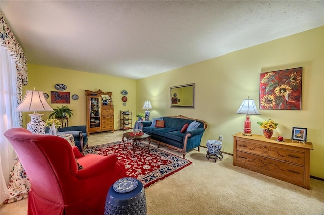 living room with light colored carpet and a textured ceiling