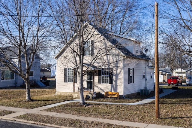 view of front facade with central AC unit and a front lawn