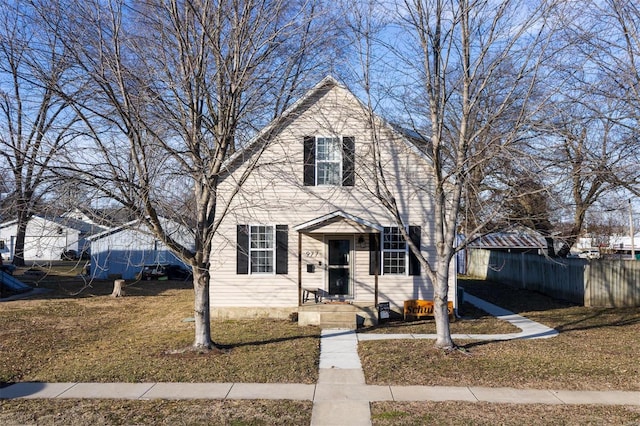 front facade featuring a front yard