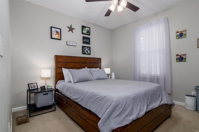 bedroom featuring light carpet and ceiling fan