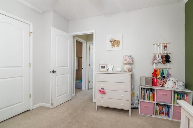 bedroom featuring light colored carpet