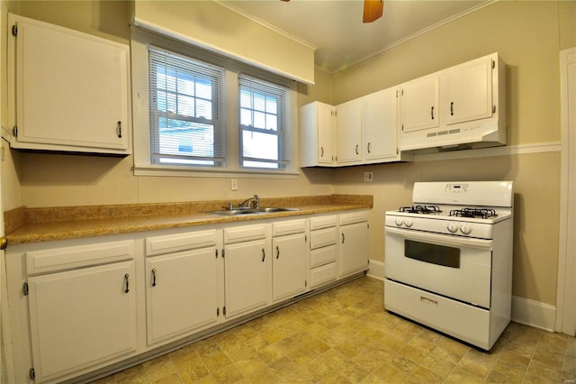 kitchen with sink, white gas stove, white cabinetry, crown molding, and ceiling fan