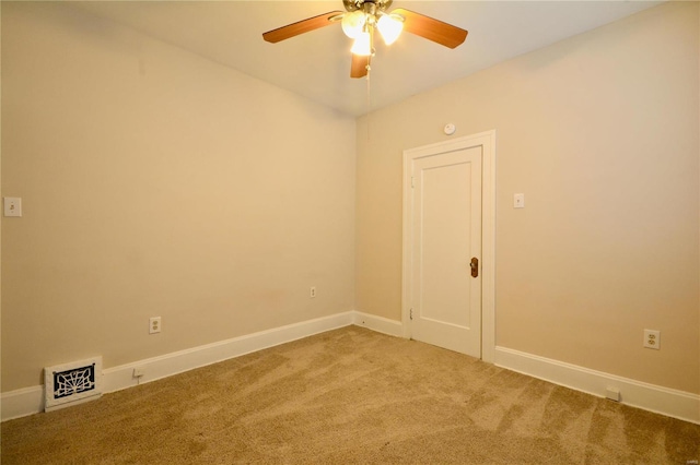 carpeted empty room with ceiling fan