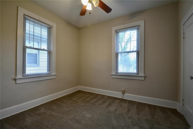 carpeted spare room with ceiling fan