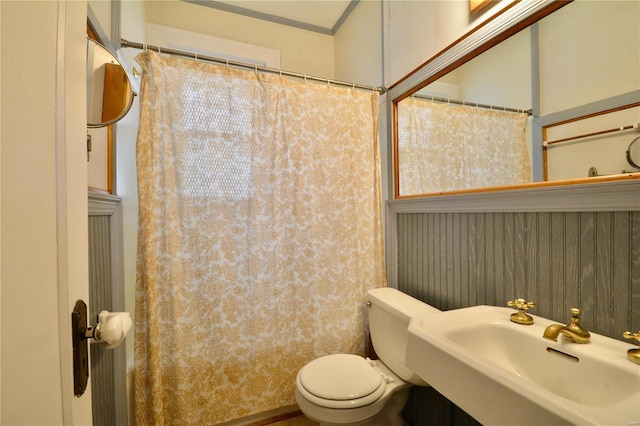 bathroom featuring sink and toilet