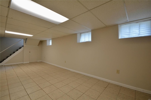 basement featuring a paneled ceiling