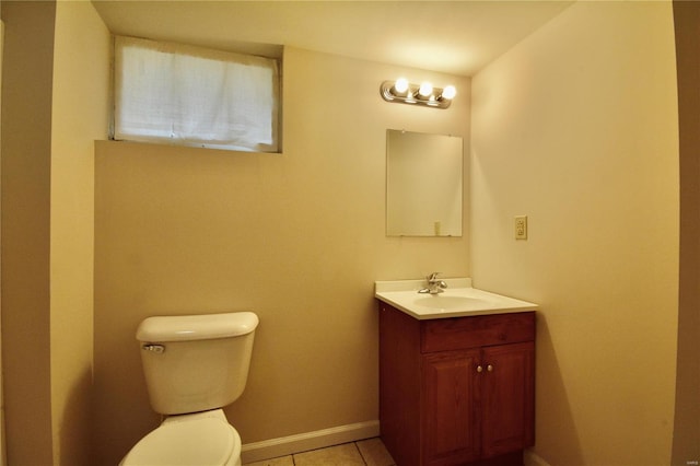 bathroom with vanity, tile patterned floors, and toilet