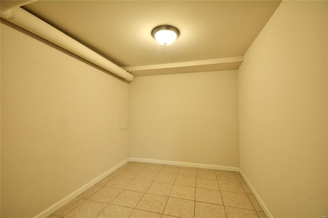 walk in closet with light tile patterned floors