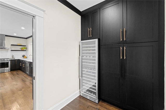 interior space featuring wine cooler and a sink