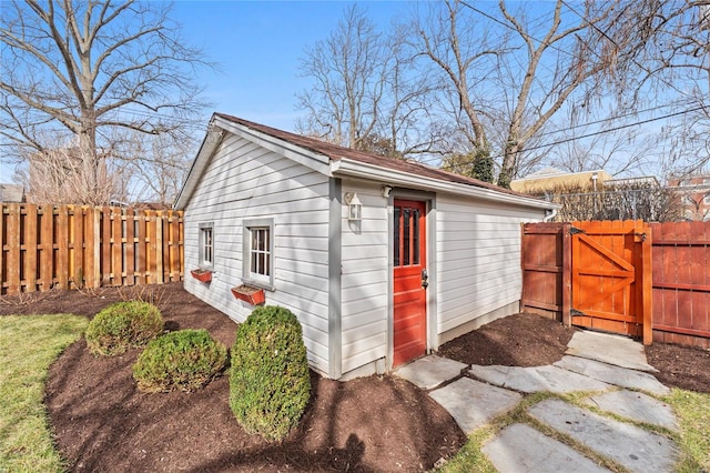 view of outdoor structure with a gate and fence