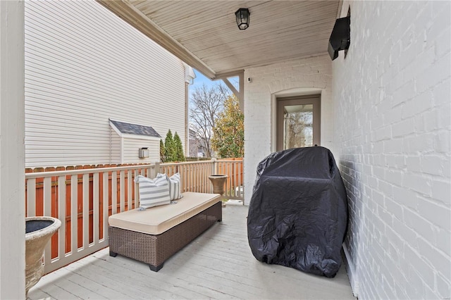 wooden terrace with area for grilling