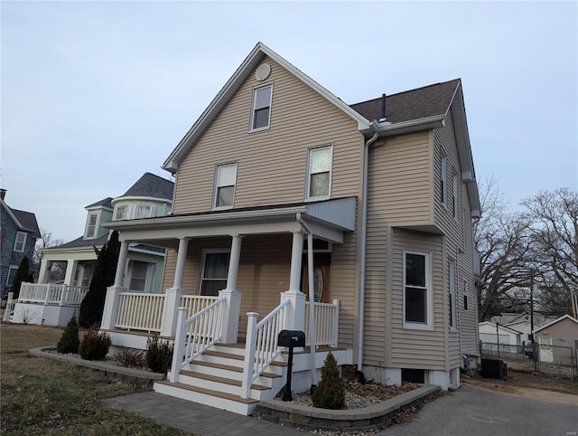 view of front of property featuring central air condition unit and a porch