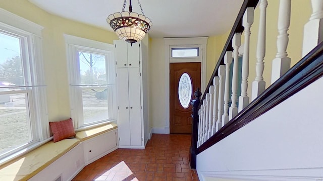 foyer featuring stairs