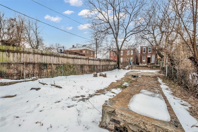 view of yard covered in snow