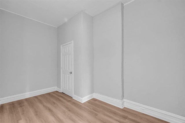 spare room with light hardwood / wood-style flooring