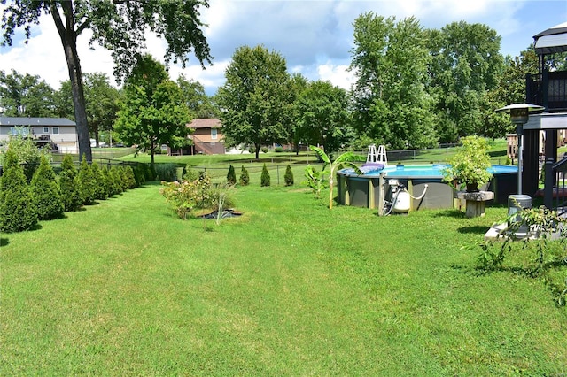 view of yard featuring a fenced in pool