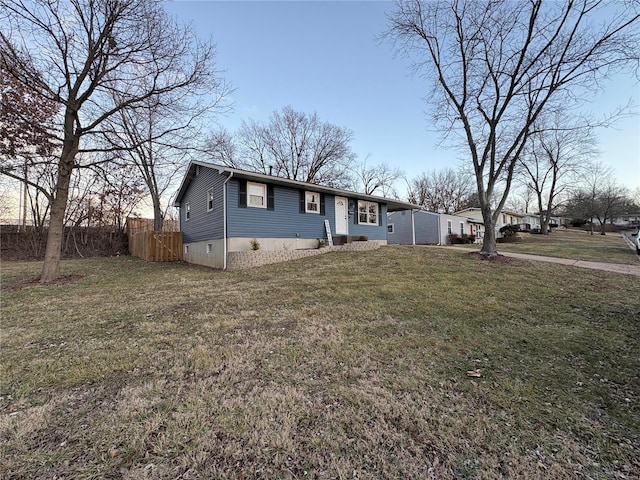 view of front of home with a lawn