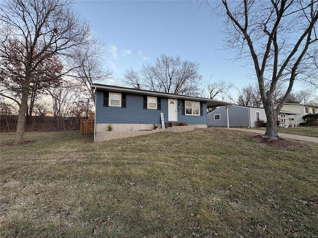 view of front of property featuring a front yard and a carport