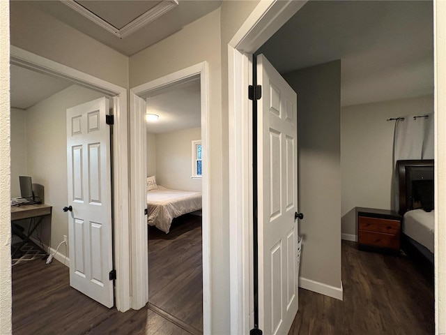 hallway with dark hardwood / wood-style flooring