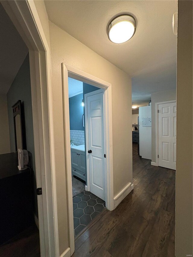 hall featuring dark wood-type flooring