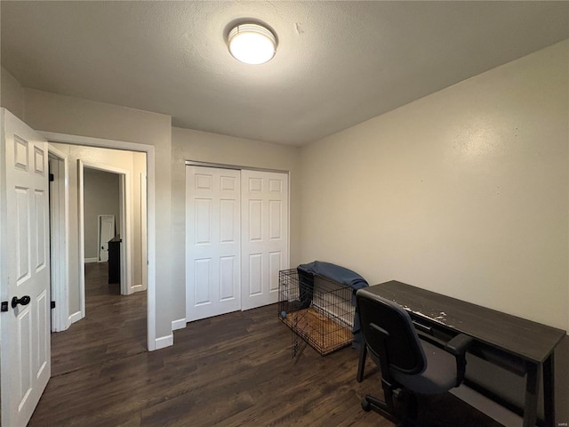 home office with dark hardwood / wood-style floors