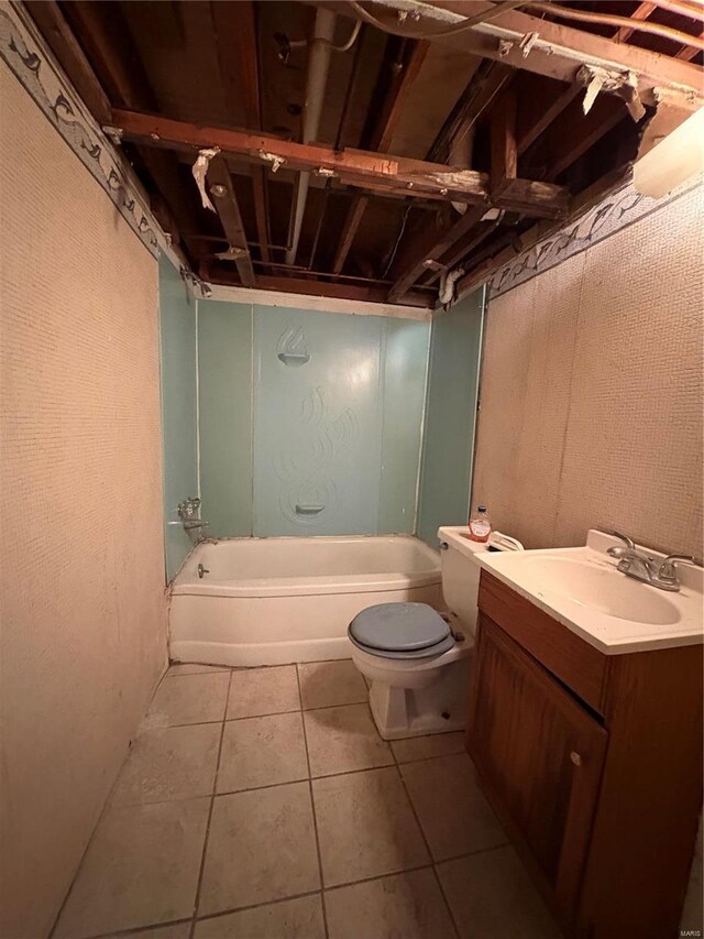 full bathroom with tile patterned flooring, vanity, shower / washtub combination, and toilet