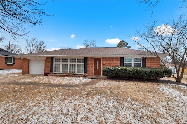 ranch-style home with a garage and brick siding