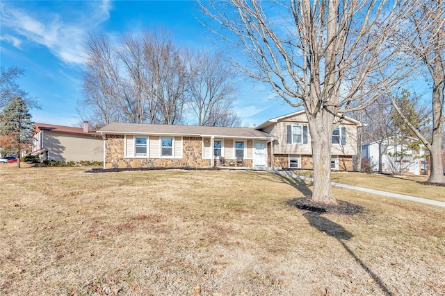 tri-level home with a front yard and a porch