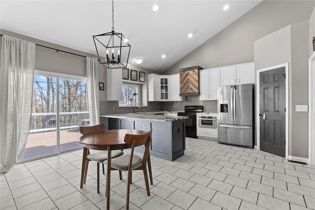 kitchen featuring white cabinetry, black electric range, stainless steel fridge with ice dispenser, hanging light fixtures, and light stone countertops