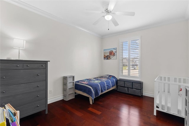 bedroom with ornamental molding, ceiling fan, and dark hardwood / wood-style flooring