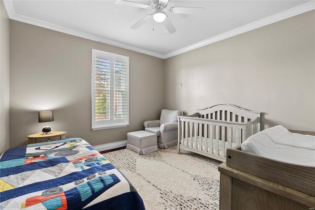 bedroom featuring crown molding, wood-type flooring, and ceiling fan