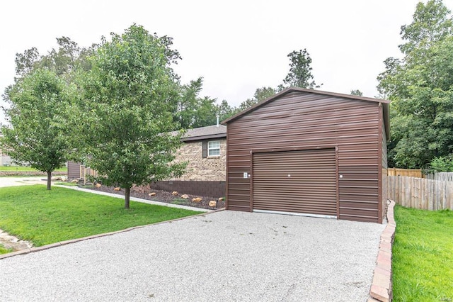 garage featuring a lawn