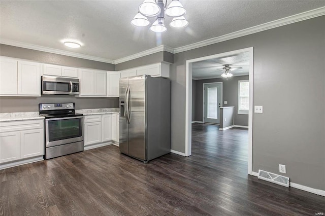 kitchen with white cabinetry, ornamental molding, stainless steel appliances, and dark wood-type flooring